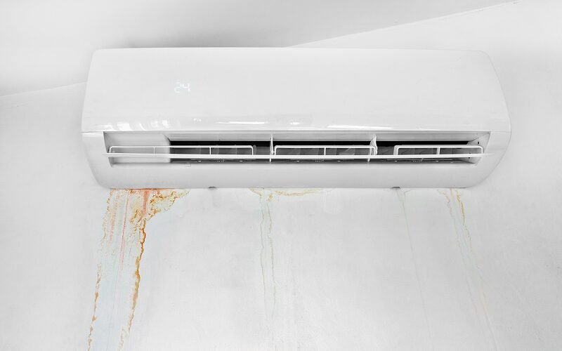 Indoor aircon unit leaking water and staining the wall.