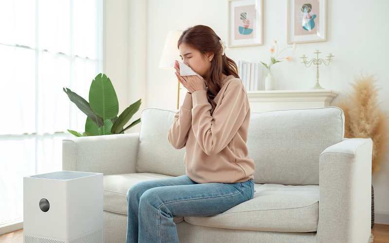 Singapore homeowner sneezing due to aircon worsening her allergies.